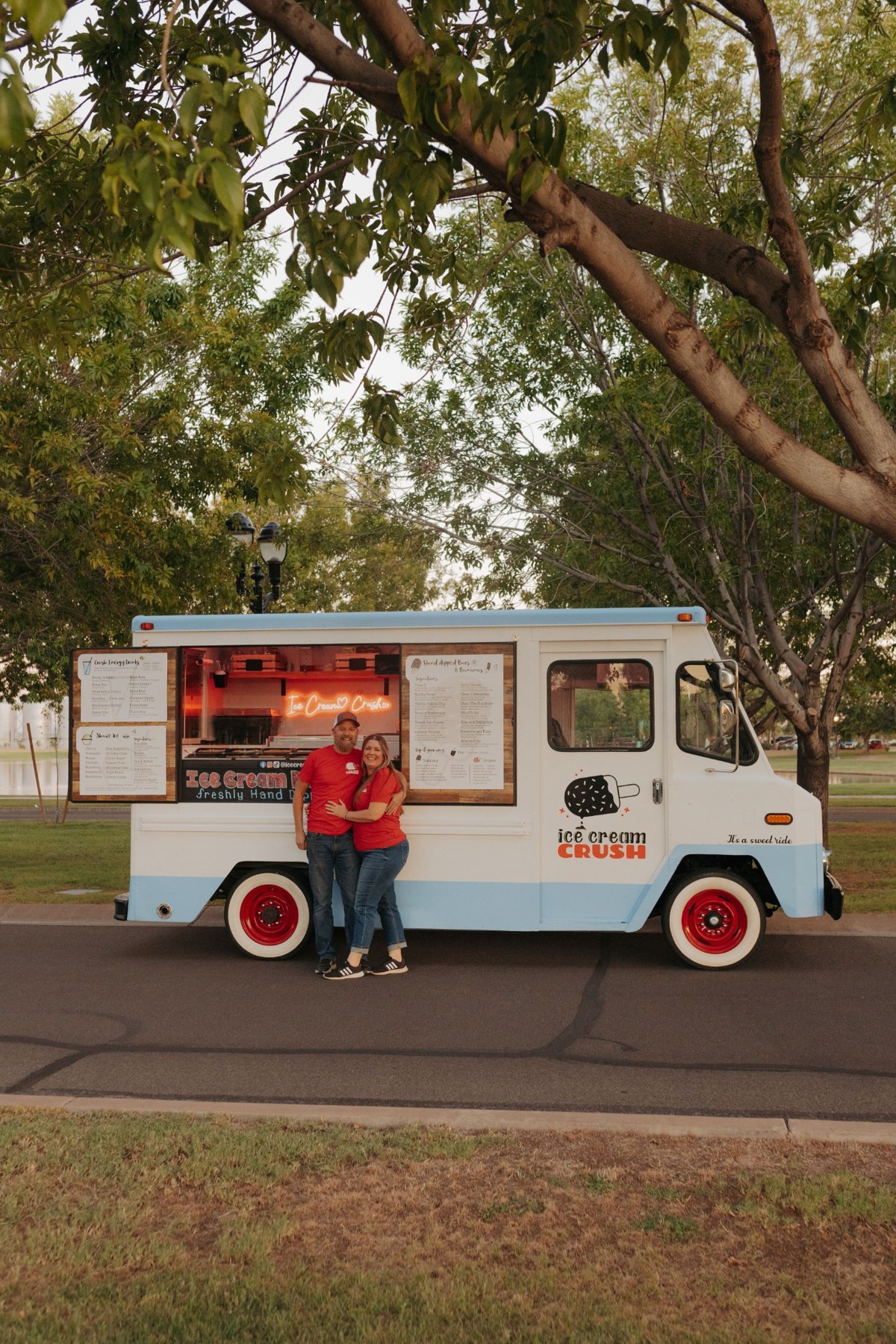 The Ice Cream Crush owners standing beside their food truck